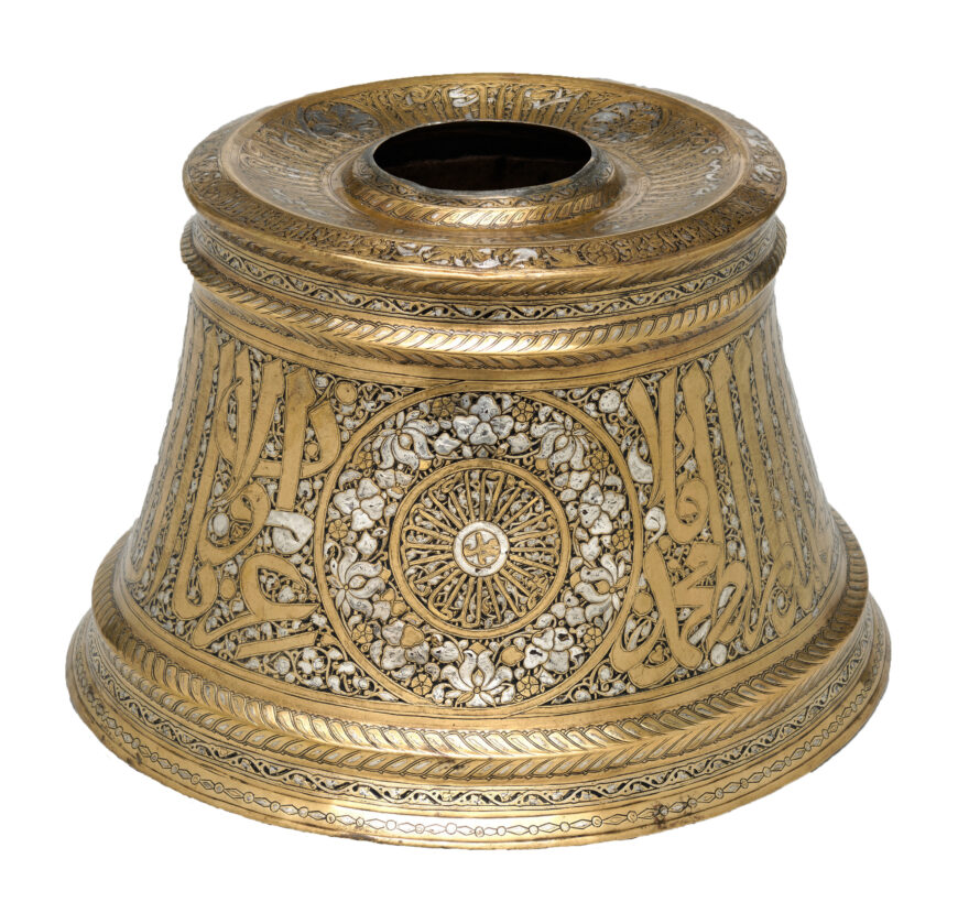 Candlestick base attributed to al-Malik al-Nasir Muhammad bin Qalawun, first half of 14th century, Egypt, brass with silver inlay, 21.1 x 33.4 cm (The Metropolitan Museum of Art)