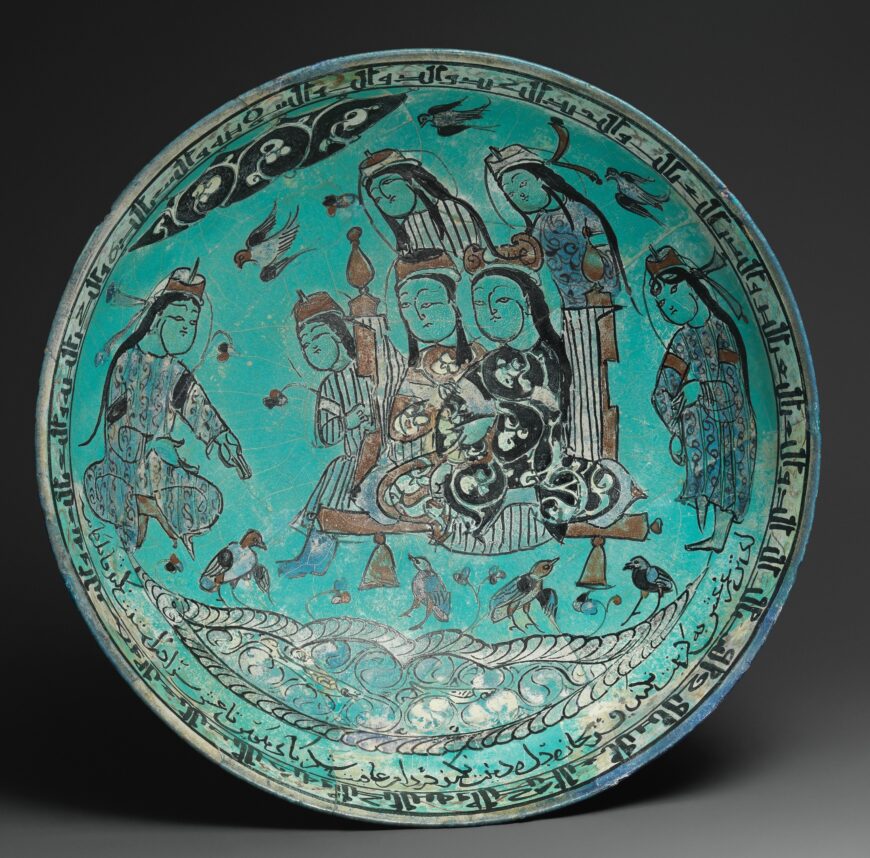 Abu Zayd, Bowl with a majlis scene by a pond, 1186 C.E., stone paste, glazed in opaque turquoise, polychrome in-glaze- and overglaze- painted, 21.6 cm diameter, Kashan, Iran (The Metropolitan Museum of Art)