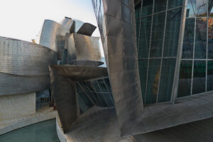 Frank Gehry, Guggenheim Museum Bilbao (exterior detail), 1993–97, titanium, limestone, glass, steel (photo: José Luis Filpo Cabana, CC BY 3.0)