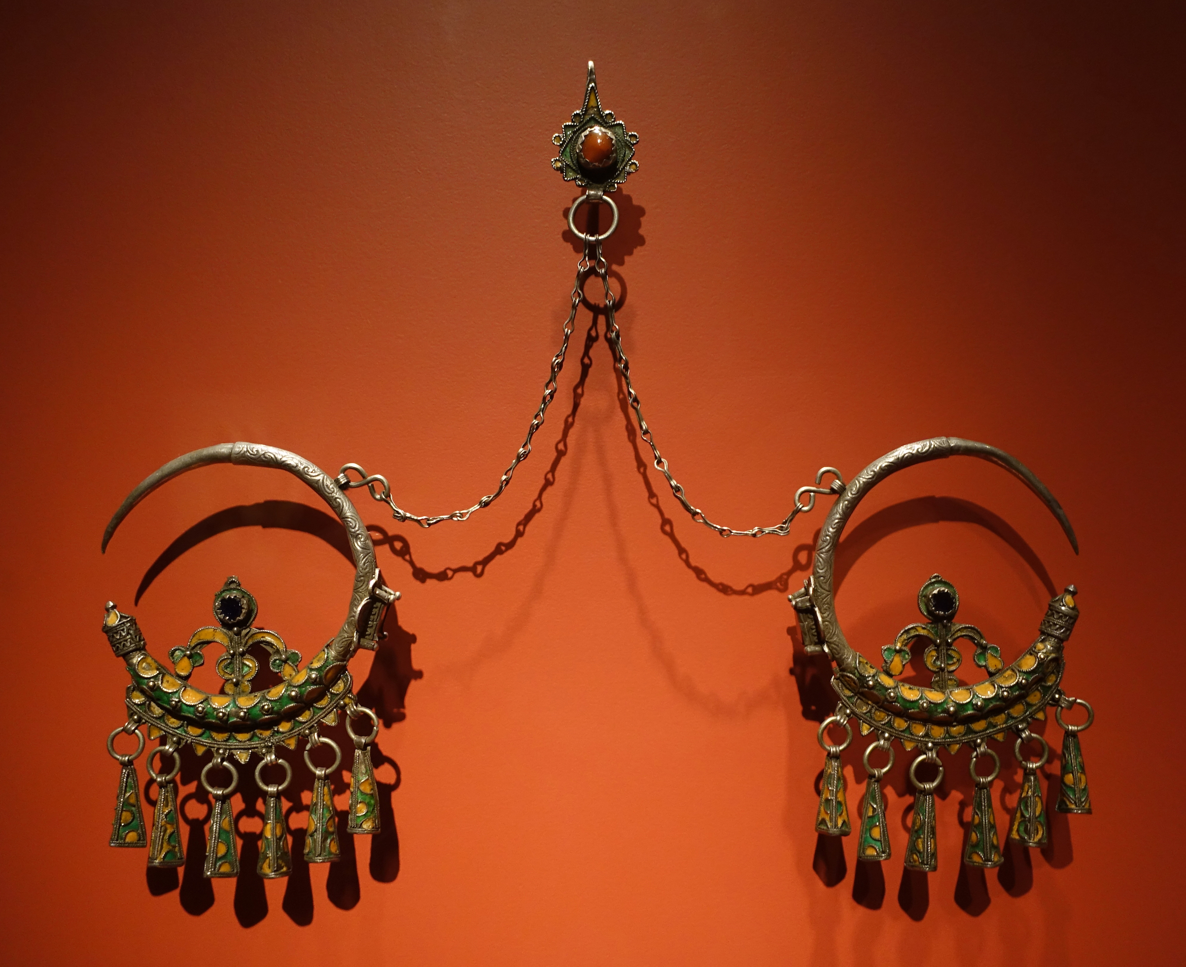 Amazigh ear pendants, early 20th century (Anti-Atlas Region, Morocco), silver alloy, enamel, glass, and carnelian, 34.4 x 20.3 x 2.9 cm (Smithsonian National Museum of African Art, Washington, D.C.)