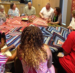 A community sewing circle hosted by Watt at the Denver Art Museum in 2013