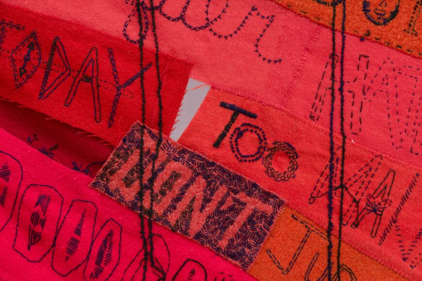 Embroidered words (detail), Marie Watt, Companion Species (Speech Bubble), 2019, reclaimed wool blankets, embroidery floss, and thread, 136 5/8 x 198 1/2 inches (Crystal Bridges Museum of American Art, Bentonville; photo: Edward C. Robison III) © Marie Watt