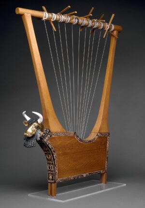Queen's Lyre (reconstruction), 2600 B.C.E., wooden parts, pegs and string are modern; lapis lazuli, shell and red limestone mosaic decoration, set in bitumen (© The Trustees of the British Museum, London)