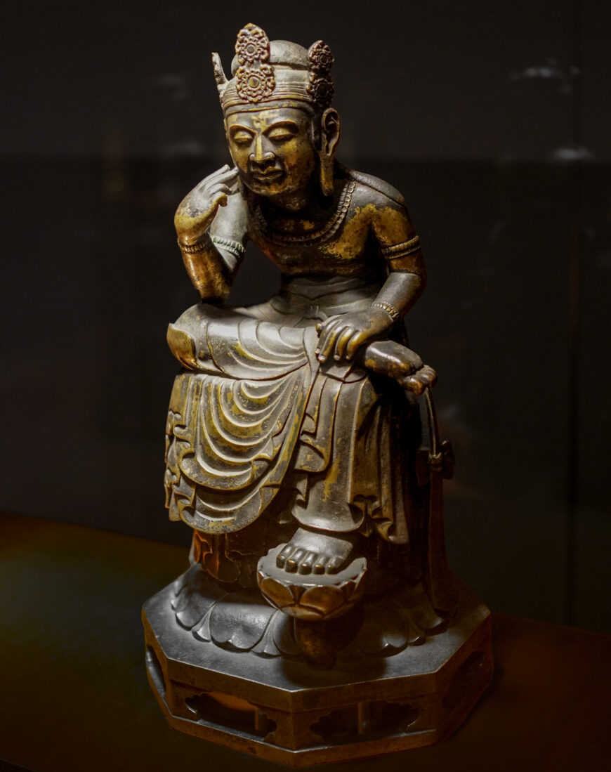 Bodhisattva sitting with his legs half-crossed, 7th century (Asuka period), gold-plated bronze, 33.7 cm high (Tokyo National Museum; photo: Steven Zucker, CC BY-NC-SA 2.0)