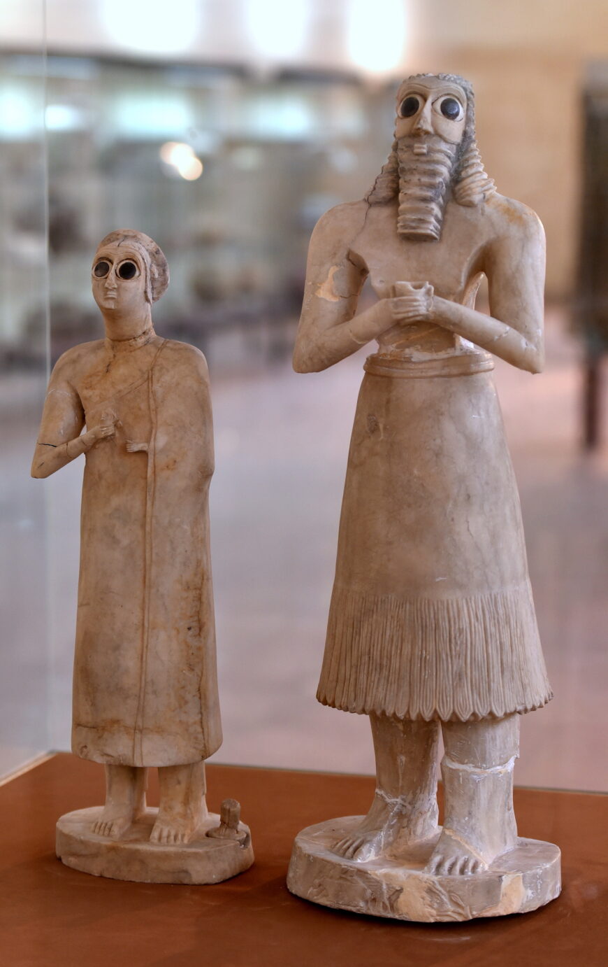 Female and male votive figures (on the right is the tallest figure of the group of twelve), from the Square Temple at Eshnunna (modern Tell Asmar, Iraq), c. 2900–2350 B.C.E. (Early Dynastic period) (The Iraq Museum, Baghdad; photo: Dr. Osama Shukir Muhammed Amin, CC BY-SA 4.0)