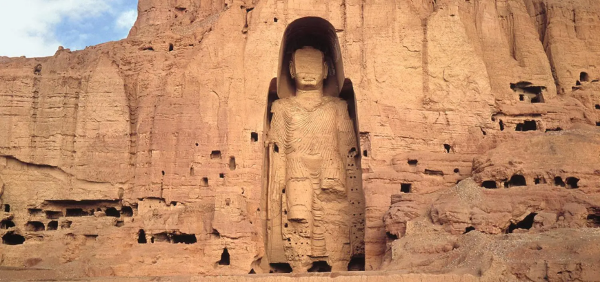 West Buddha surrounded by caves, c. 6th–7th century C.E. (Bamiyan, Afghanistan), stone, stucco, paint, 175 feet high, destroyed 2001 (photo: Afghanistan Embassy) © Afghanistan Embassy
