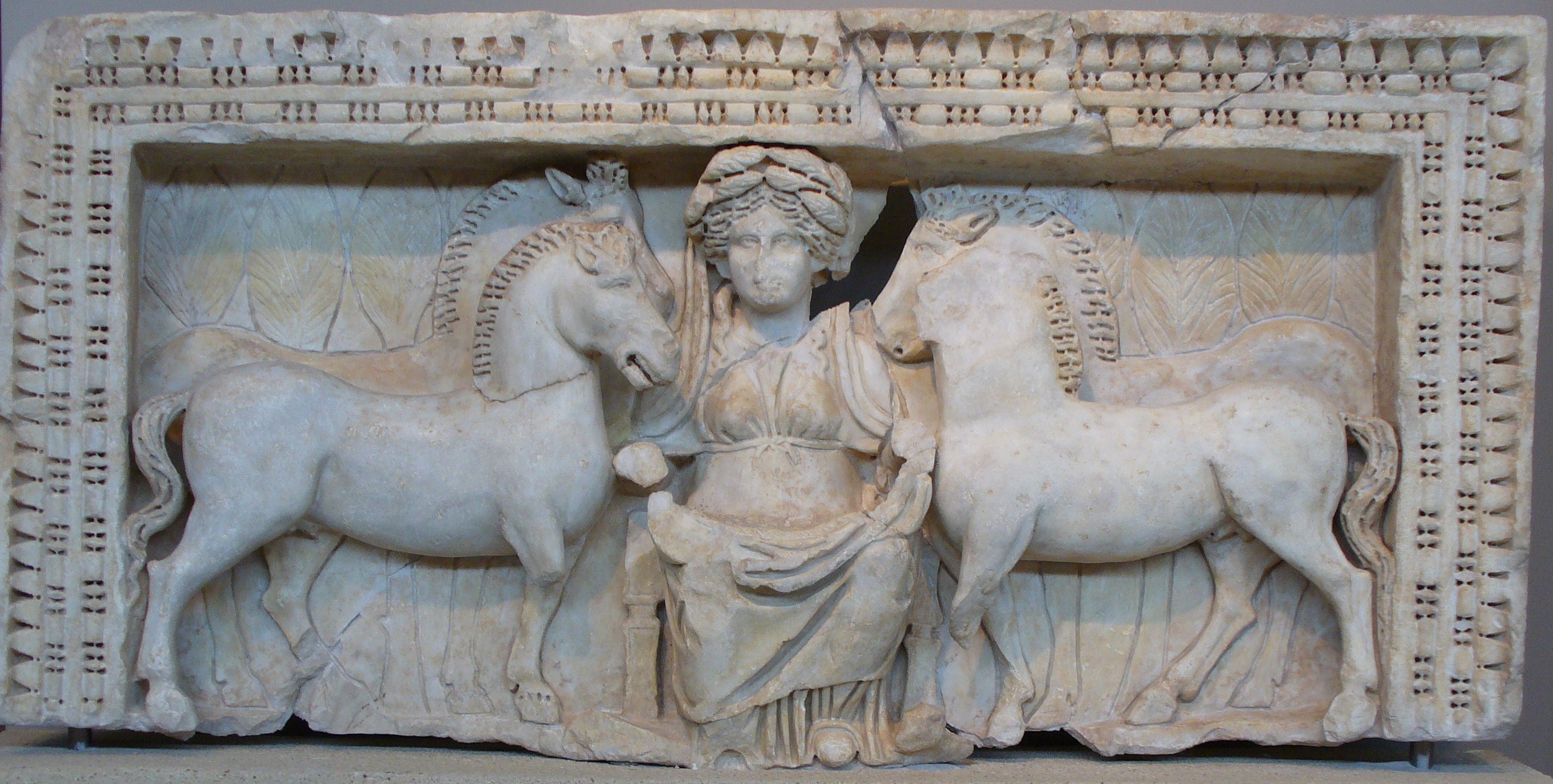 Relief sculpture of Epona framed by four horses, 4th century C.E., marble, 68.7 x 141 x 16 cm (Archaeological Museum, Thessaloniki; photo: QuartierLatin1968, CC BY-SA 3.0). Excavated in 1962 at Thessaloniki, Greece