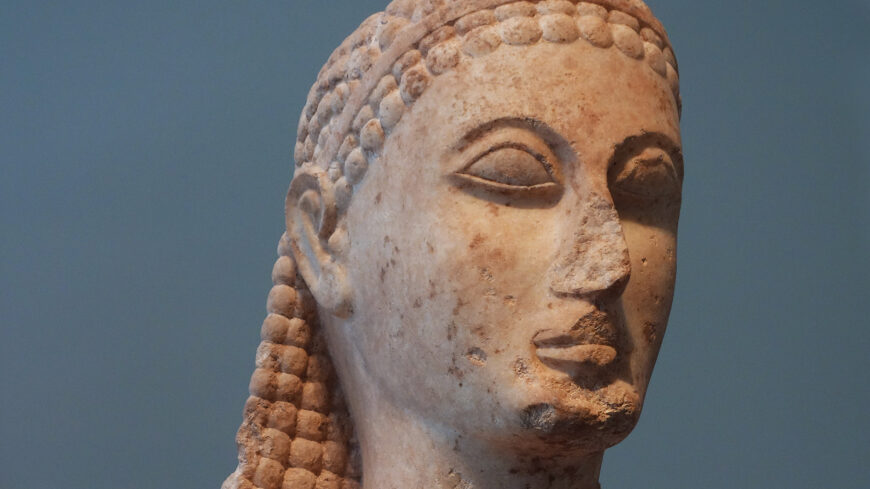 Head (detail), New York Kouros, c. 600–580 B.C.E., marble, 6 feet 4 inches high (The Metropolitan Museum of Art, New York; photo: Steven Zucker, CC BY-NC-SA 2.0)