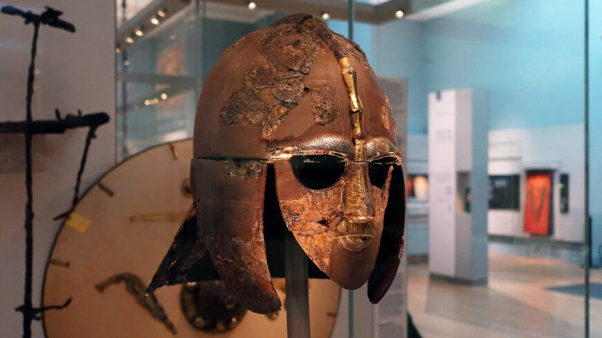 Helmet from the Sutton Hoo ship-burial, Suffolk, England, iron, copper alloy, gold, tin, garnet, and silver, late 6th–early 7th century, 31.8 x 21.5 x 25.5 cm (The British Museum; photo: Steven Zucker, CC BY-NC-SA 2.0)