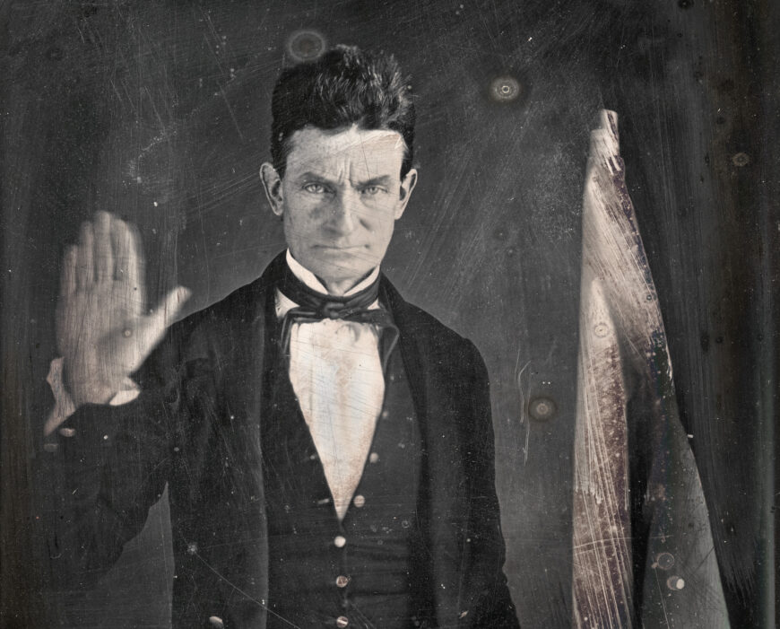 John Brown with flag (detail), Augustus Washington, John Brown, c. 1846–47, quarter-plate daguerreotype, 11.4 x 19.7 cm (National Portrait Gallery, Smithsonian Institution, Washington, D.C.)