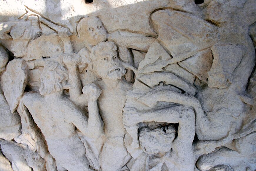 South side of the Arch at Orange showing bearded men fighting in the Hellenistic Baroque battle scene. The deeply carved outlines made the sculptures easier to see from the ground. This photo was taken up close while the monument was being cleaned. Arch at Orange, France, 20s B.C.E., stone, 19.21 x 19.57 x 8.4 m (photo: Jean-Louis Zimmermann, CC BY-SA 2.0)