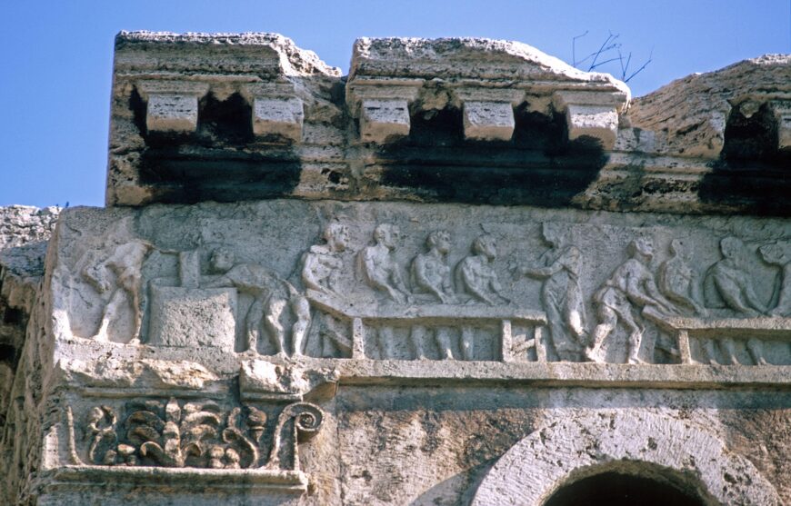 Figural frieze, north side (detail). A togate figure oversees bare-chested workers kneading dough (photo: William L. MacDonald Collection, Department of Art and Archaeology, Princeton University)