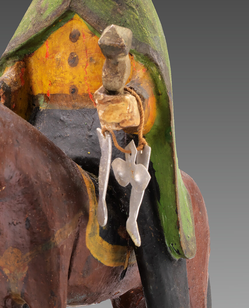 Milagros around Balthazar's wrist (detail), Cabán group, Los Reyes Magos, c. 1875–1900, carved and painted wood with metal and string, 20.7 x 30.3 x 15.3 cm (Smithsonian American Art Museum, Washington, D.C.)