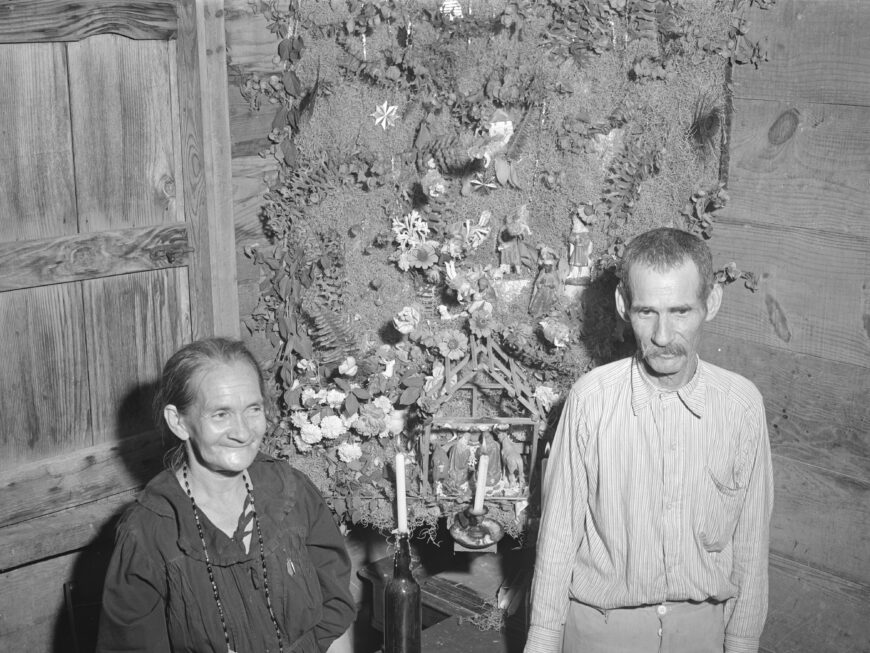 Hosts of Velorio de Reyes party with their shrine. Jack Delano, Tenant farmer and his wife at whose home a Three Kings' eve party was held, 1942, Guánica, Puerto Rico (Library of Congress, Washington, D.C.)