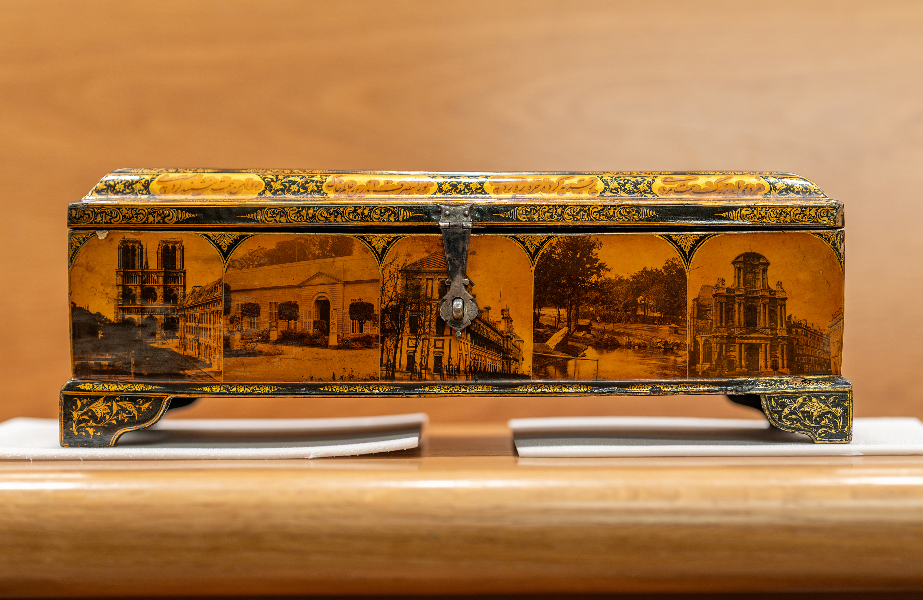 Writing box with utensils, decorated with photographs of Nasir a-Din Shah, his court, and views of Paris and Tehran, Iran