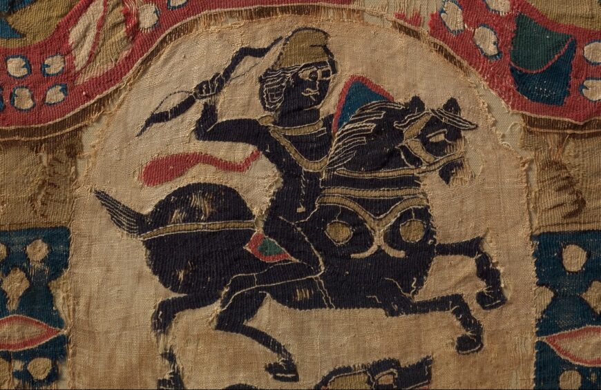 Mounted horseman (detail), Fragment from a Coptic Hanging, 5th century (attributed to Egypt), linen, wool, plain weave and tapestry weave, 104 x 63 cm (The Metropolitan Museum of Art, New York)