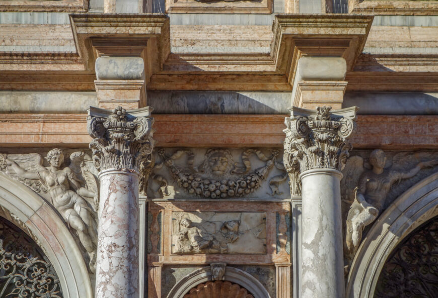 Column capitals, spandrel figures, swag, and relief sculpture (detail), Jacopo Sansovino, Loggetta, Piazza San Marco, Venice, 1538–46 (photo: Steven Zucker, CC BY-NC-SA 4.0)
