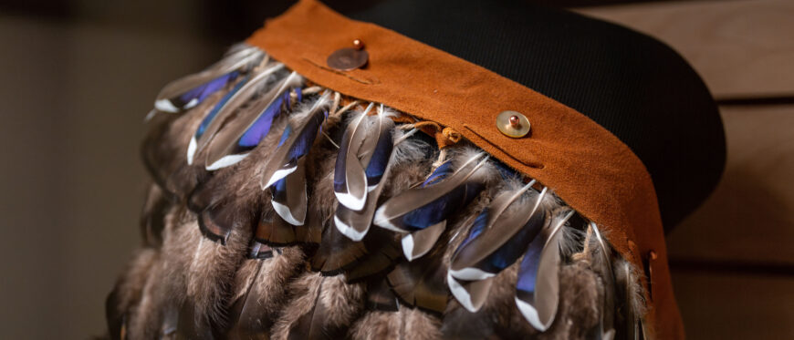 Raven Custalow, <em>Puttawus</em>, 2020, plant-based cordage, sinew, turkey feathers, shells, and possibly copper, 109.2 x 7.6 x 123.2 cm (Virginia Museum of Fine Arts, Richmond) © Raven Custalow